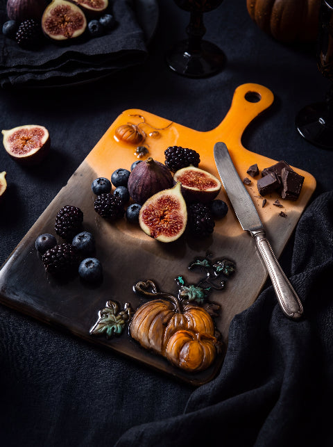 Salem Board styled with figs, berries and chocolate on a dark autumn table