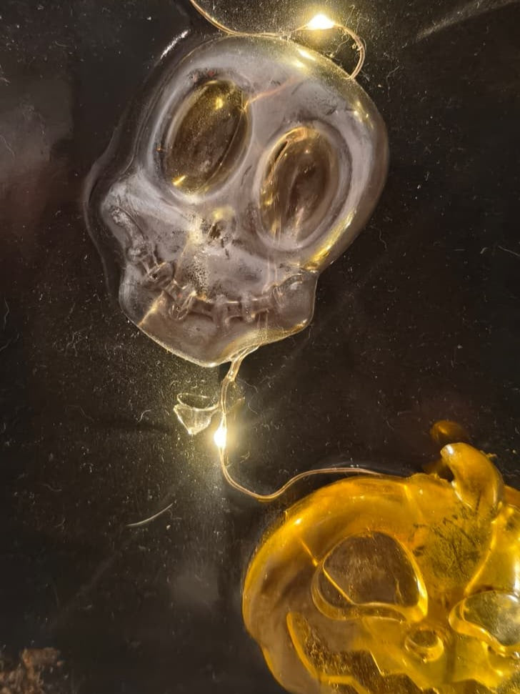 Close-up of the resin skull and glowing pumpkin on The Midnight Portal panel