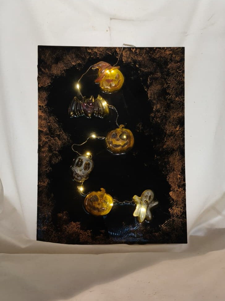 Full view of The Midnight Portal LED panel with pumpkins, bat, skull and ghost